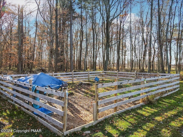 view of swimming pool featuring fence