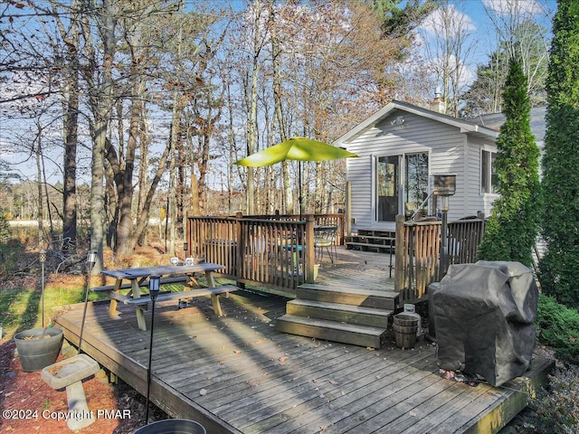 wooden terrace with area for grilling