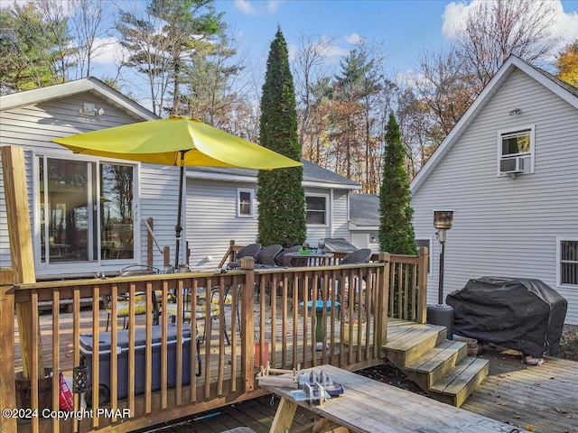 wooden terrace with area for grilling