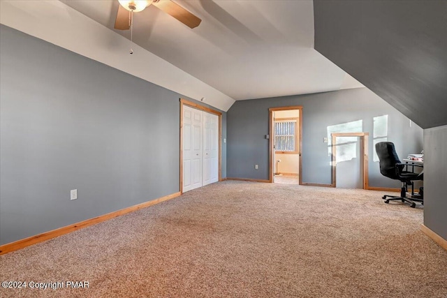 office area with lofted ceiling, carpet floors, a ceiling fan, and baseboards