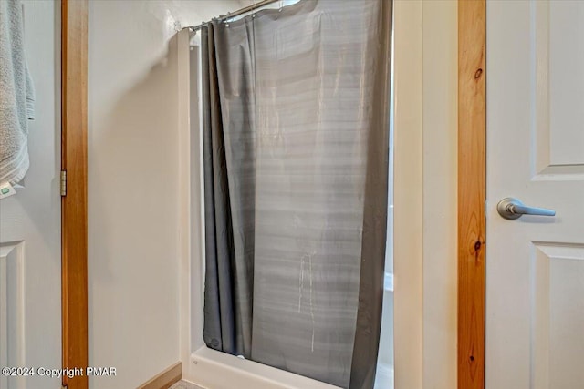 bathroom with curtained shower