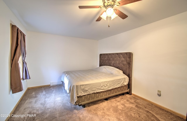 carpeted bedroom featuring a ceiling fan and baseboards