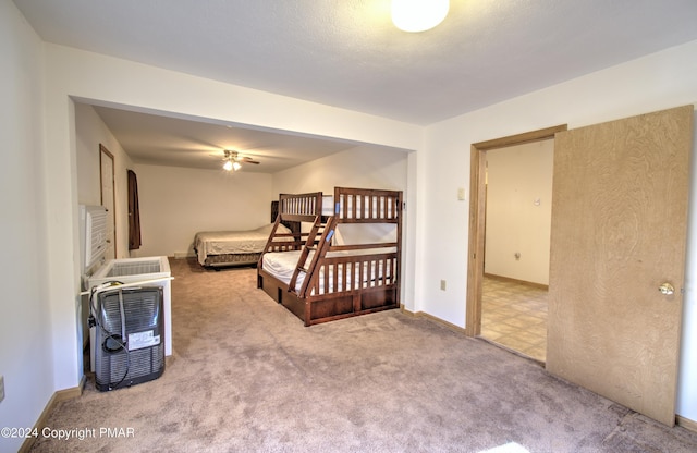 carpeted bedroom featuring baseboards