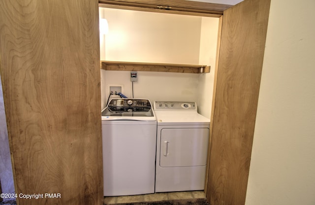 clothes washing area with laundry area and washing machine and clothes dryer