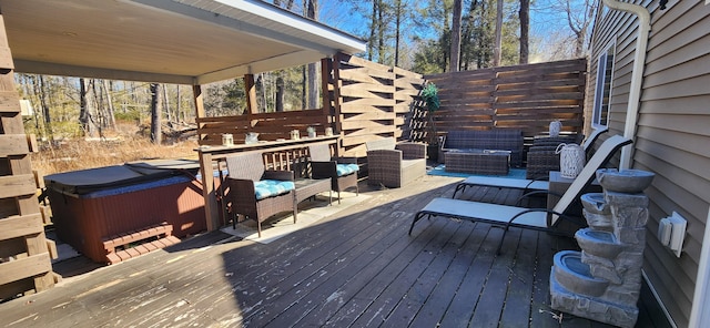 deck featuring an outdoor hangout area and a hot tub