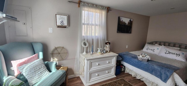 bedroom with wood finished floors