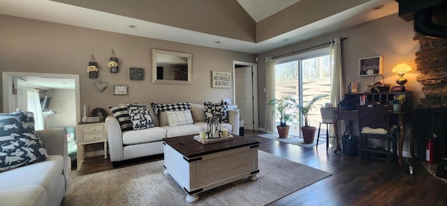 living area with lofted ceiling and wood finished floors