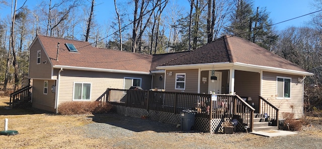 view of front of home featuring roof with shingles