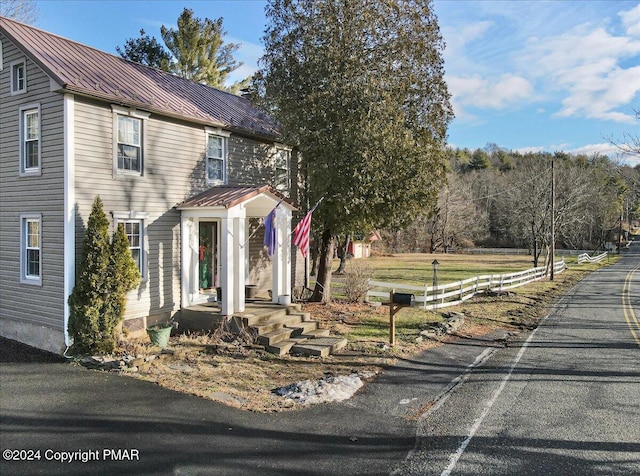 view of front of property featuring a standing seam roof and metal roof