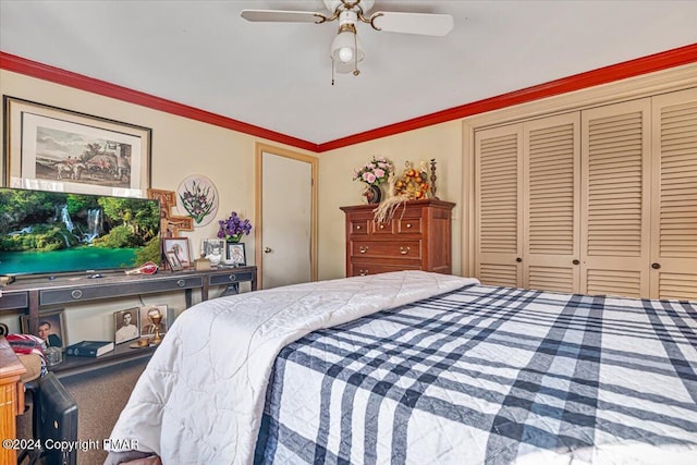 carpeted bedroom with ornamental molding, a closet, and ceiling fan