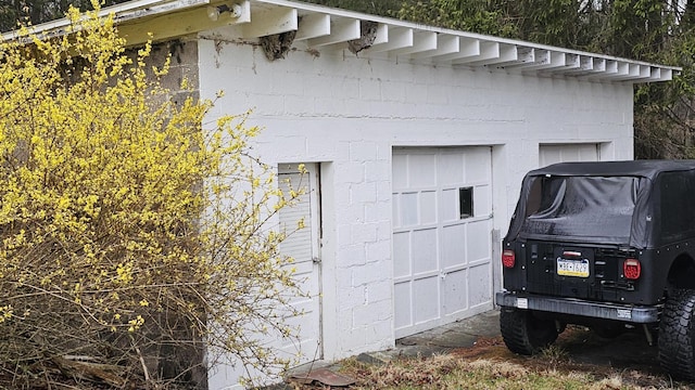 view of property exterior featuring concrete block siding