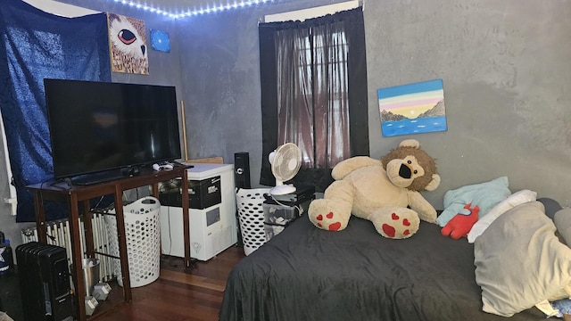 bedroom with wood finished floors