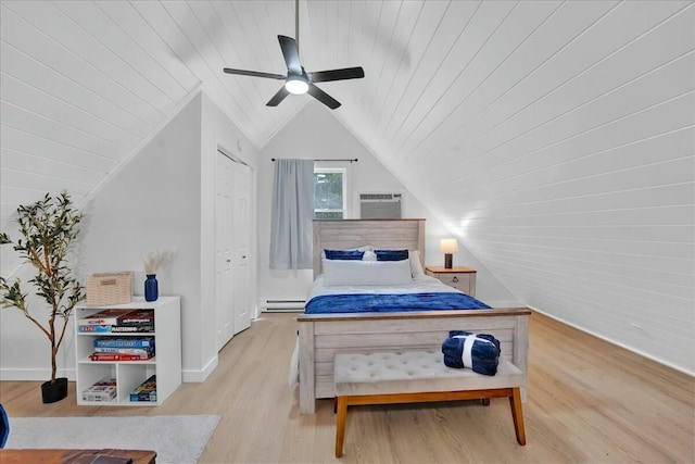 bedroom featuring wood ceiling, wood finished floors, a wall mounted air conditioner, vaulted ceiling, and baseboard heating