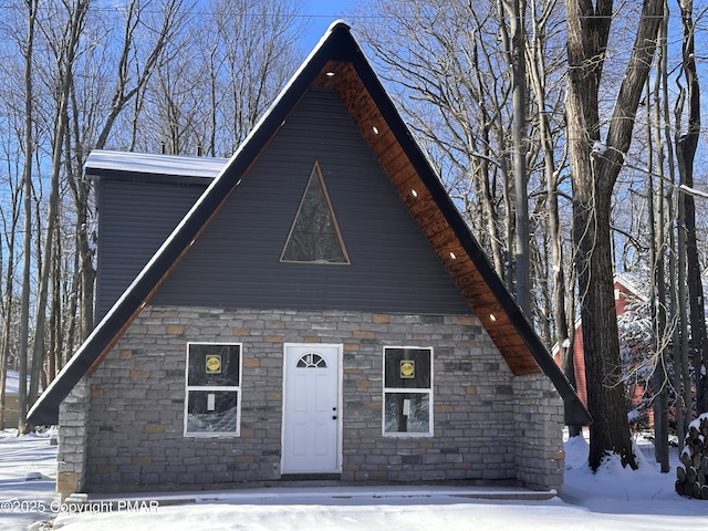 a-frame home with stone siding