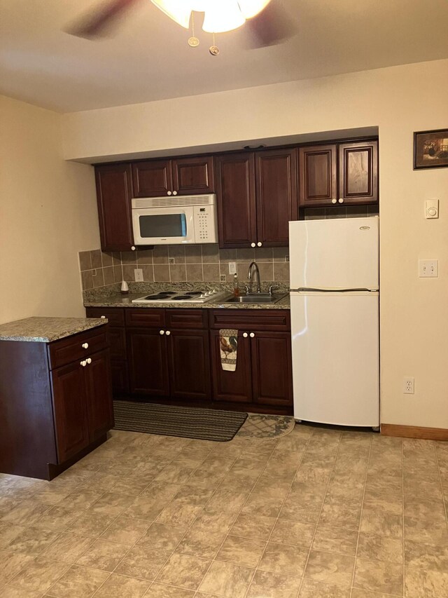 115 Gap View Rd, Milford, PA 18337 - kitchen featuring white appliances, tasteful backsplash, dark brown cabinetry, light stone countertops, and ceiling fan