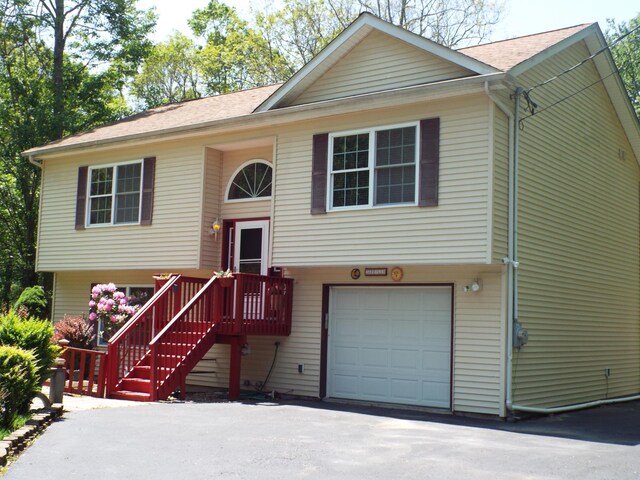 115 Gap View Rd, Milford, PA 18337 - split foyer home with an attached garage, asphalt driveway, and roof with shingles