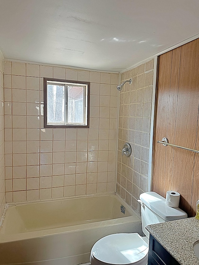 bathroom with vanity,  shower combination, and toilet