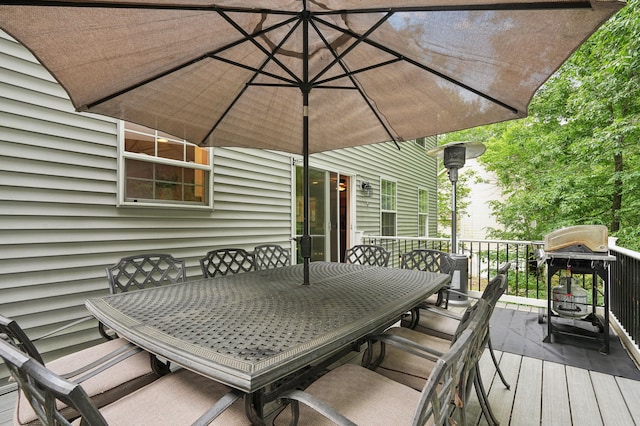 wooden terrace with outdoor dining area