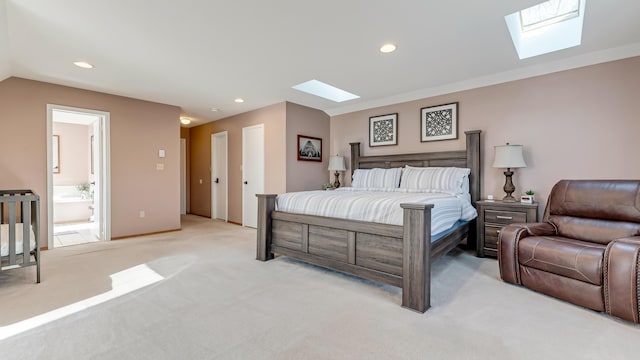 bedroom featuring recessed lighting, light colored carpet, a skylight, and ensuite bathroom