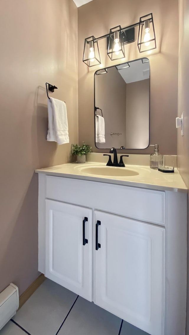 bathroom with vanity and a baseboard heating unit