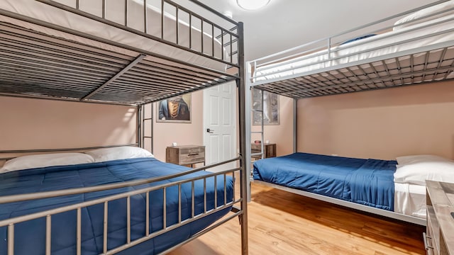 bedroom featuring wood finished floors