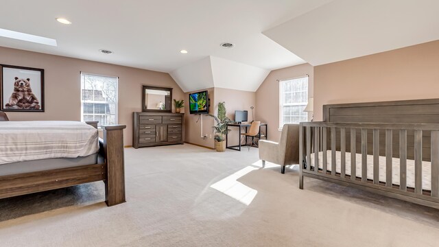 bedroom featuring visible vents, multiple windows, carpet, and vaulted ceiling