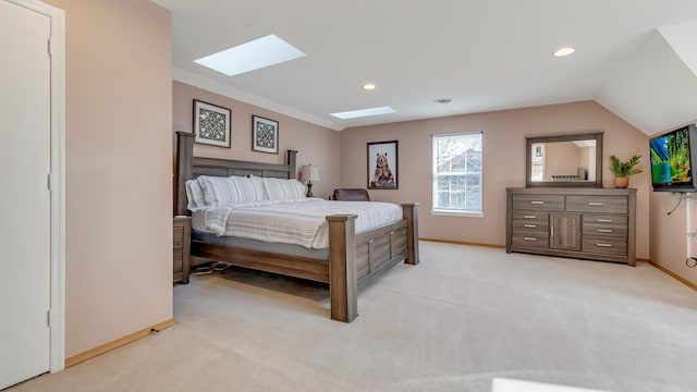 bedroom featuring vaulted ceiling with skylight, recessed lighting, baseboards, and light carpet