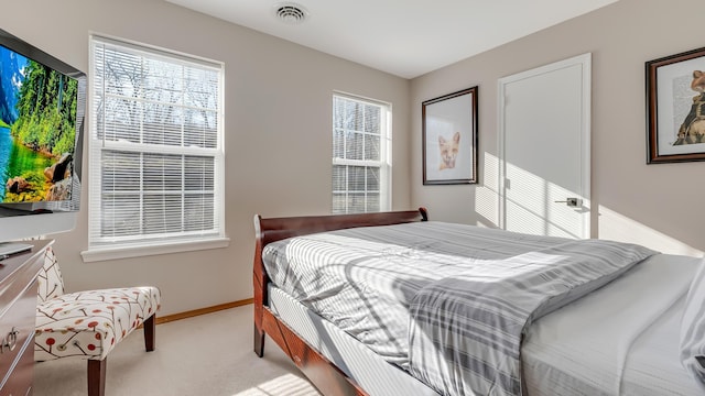 bedroom with baseboards, visible vents, and carpet floors