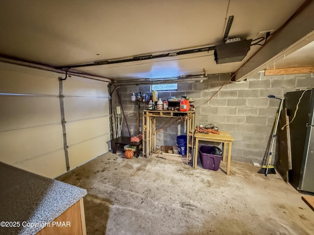 garage with stainless steel fridge