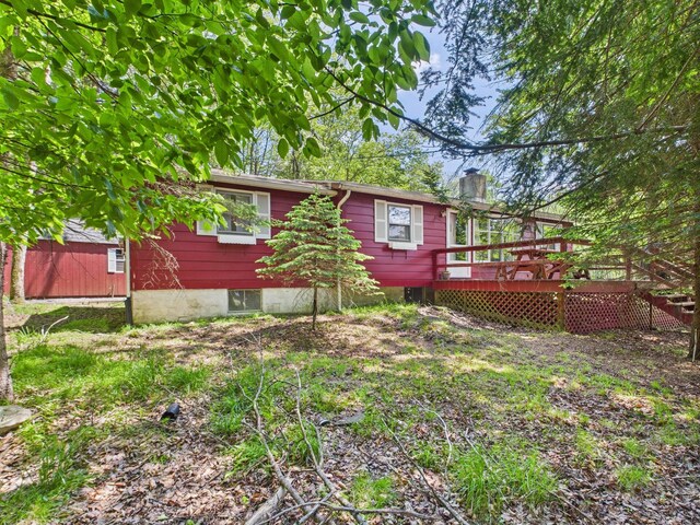 105 Buffalo Trl, Pocono Lake, PA 18347 - back of property featuring a deck and a chimney