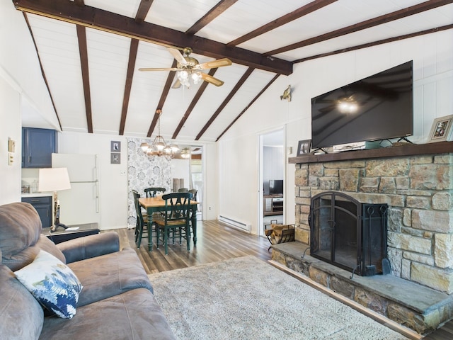 105 Buffalo Trl, Pocono Lake, PA 18347 - living room featuring wood finished floors, a baseboard radiator, a chandelier, ceiling fan, and a stone fireplace