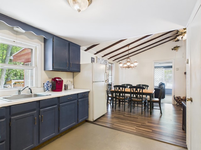 105 Buffalo Trl, Pocono Lake, PA 18347 - kitchen with a sink, freestanding refrigerator, healthy amount of natural light, a chandelier, and wood ceiling