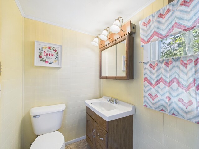 105 Buffalo Trl, Pocono Lake, PA 18347 - half bath featuring vanity, toilet, ornamental molding, and tile walls