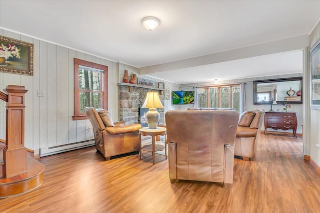 253 Thomas Rd, Blakeslee, PA 18610 - living area featuring baseboard heating, wood finished floors, and wooden walls
