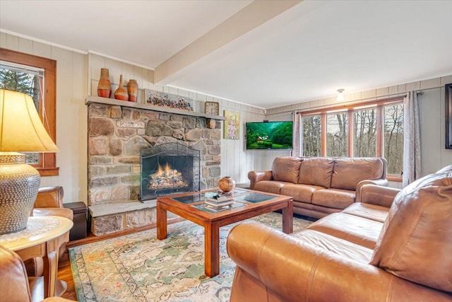 253 Thomas Rd, Blakeslee, PA 18610 - living room featuring wood finished floors, crown molding, a fireplace, and beam ceiling