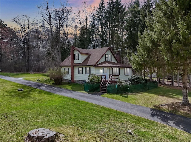 253 Thomas Rd, Blakeslee, PA 18610 - view of front facade with a chimney and a lawn