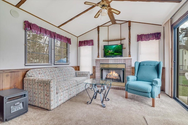 253 Thomas Rd, Blakeslee, PA 18610 - carpeted living room featuring ceiling fan, plenty of natural light, a fireplace, and wainscoting