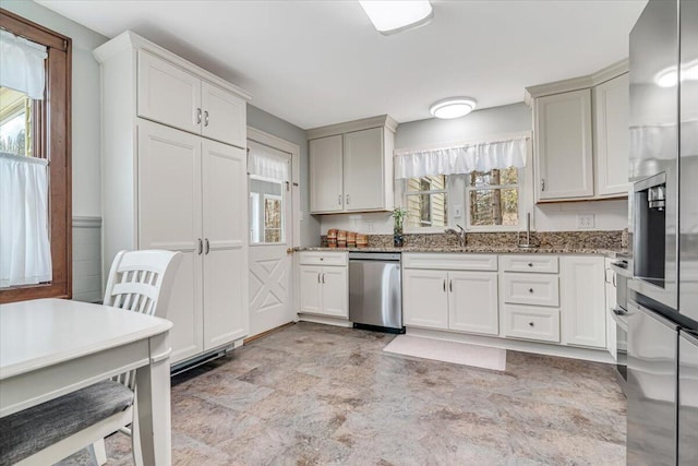 253 Thomas Rd, Blakeslee, PA 18610 - kitchen with stainless steel appliances, plenty of natural light, stone counters, and a sink