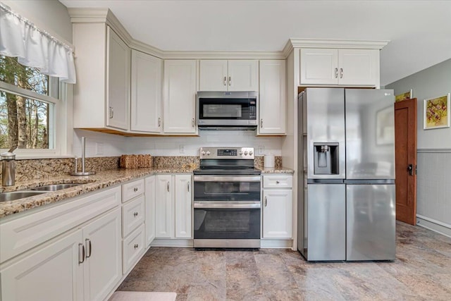 253 Thomas Rd, Blakeslee, PA 18610 - kitchen featuring stainless steel appliances, light stone countertops, and a sink