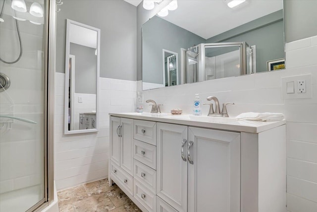 253 Thomas Rd, Blakeslee, PA 18610 - full bath with a shower stall, tile walls, double vanity, and stone finish floors