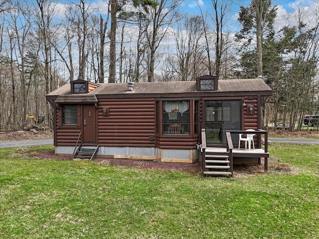 253 Thomas Rd, Blakeslee, PA 18610 - view of front of house with a front yard, entry steps, a shingled roof, and log exterior