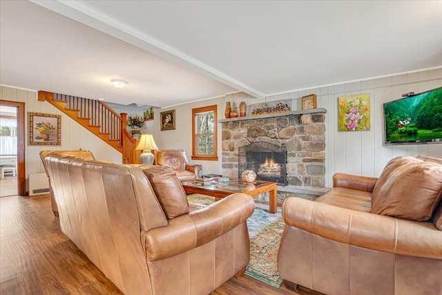 253 Thomas Rd, Blakeslee, PA 18610 - living room featuring healthy amount of natural light, wood finished floors, stairs, ornamental molding, and a fireplace
