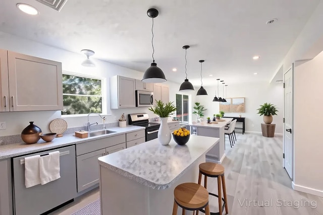 4105 Arbutus Dr Unit 1200, Tobyhanna, PA 18466 - kitchen featuring stainless steel appliances, a kitchen island, gray cabinets, a sink, and recessed lighting
