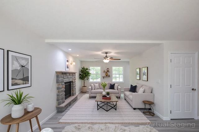 4105 Arbutus Dr Unit 1200, Tobyhanna, PA 18466 - living area with baseboards, wood finished floors, a fireplace, and a ceiling fan