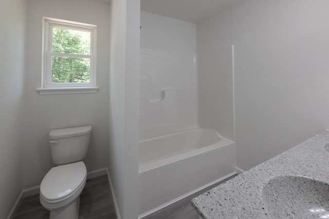 4105 Arbutus Dr Unit 1200, Tobyhanna, PA 18466 - full bathroom with toilet, baseboards, vanity,  shower combination, and wood finished floors