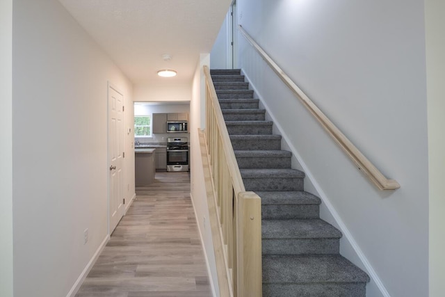 4105 Arbutus Dr Unit 1200, Tobyhanna, PA 18466 - stairway with wood finished floors and baseboards