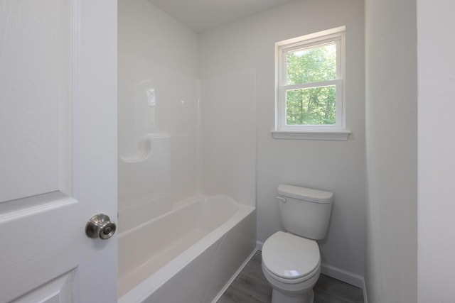 4105 Arbutus Dr Unit 1200, Tobyhanna, PA 18466 - bathroom with toilet, baseboards, wood finished floors, and washtub / shower combination