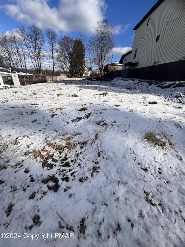 view of yard covered in snow