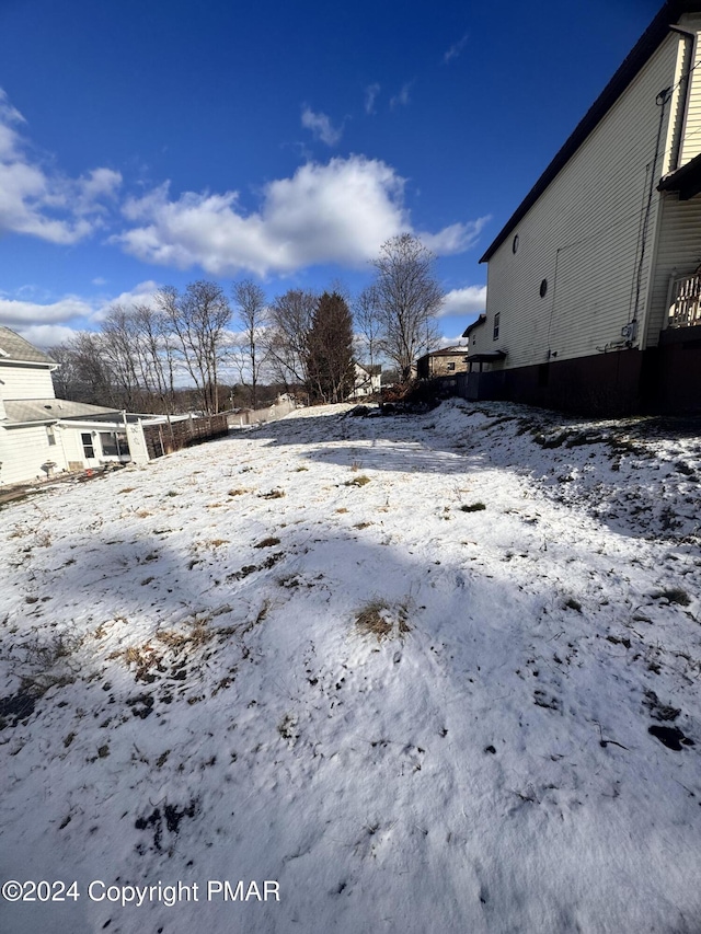 view of yard covered in snow