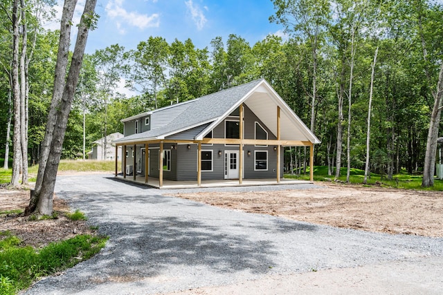 21 Wilde Gln, Albrightsville, PA 18210 - view of front of property with covered porch, gravel driveway, and a shingled roof